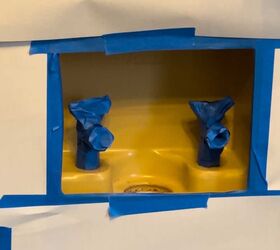 She taped up her ugly laundry hookups to make them much less of an eyesore