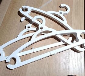 She puts zip ties on some plastic hangers to solve this closet clutter problem in a snap