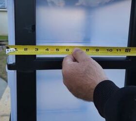 Measuring the storage bin dimensions for a perfect fit.