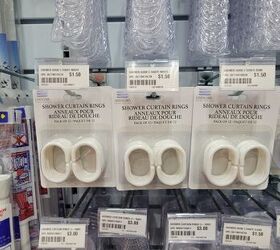 She grabs a pack of shower curtain rings from the dollar store for this stunning decor idea