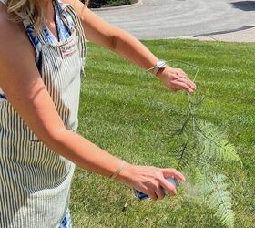 She spray paints faux ferns outside for stunning indoor decor