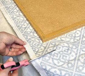 She puts a corkboard over some fabric for this cute decor idea