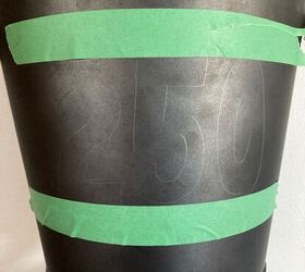 She taped up a Dollarama pail for this eye-catching outdoor decor idea