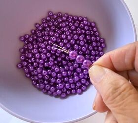 She strands a bunch of purple beads for this magical accent