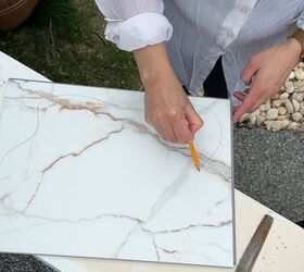 She sawed off part of this vinyl floor plank for this idea that made her table so much more stylish