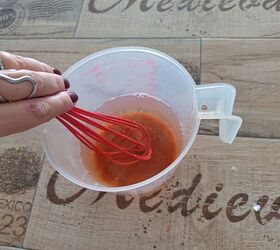 Use this natural vinegar-based weed killer with Dawn and powdered pepper to keep your garden chemical-free