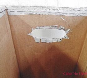 cat litter cardboard box makeover, cutting stickers to fit into cut out handle of cardboard box