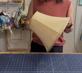 She brings an old lampshade outside for the smartest summer hack we've seen in a <em>while</em>