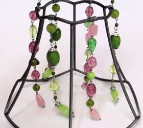 upcycled lampshade wind chime, necklaces sections attached within the lampshade frame sections