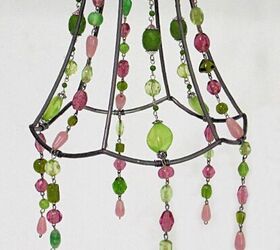 upcycled lampshade wind chime, hanging necklace sections attached to lampshade frame