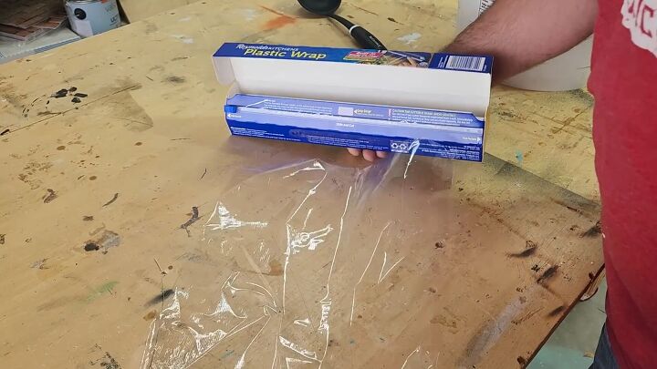 Saran wrap makes creating paver molds easy and quick