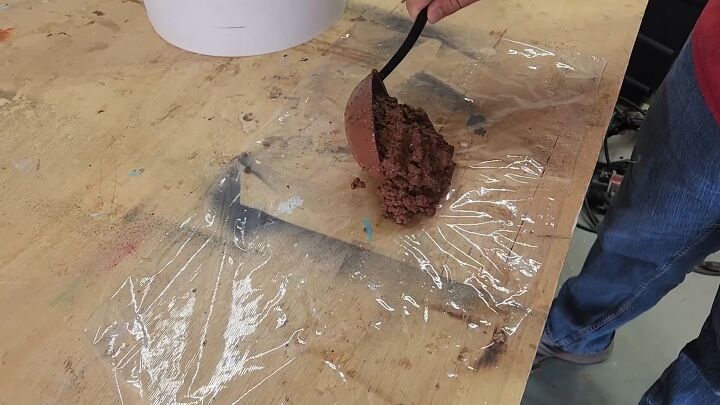 A spoodle is perfect for spreading the concrete evenly on the wrap