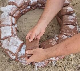 Lay each layer of pavers on top of the seams for a secure fit