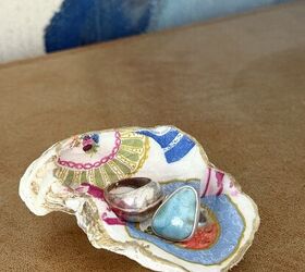 decoupage shells as wall art diy oyster shell flowers, A decoupaged oyster shell used as a trinket holder with two rings inside
