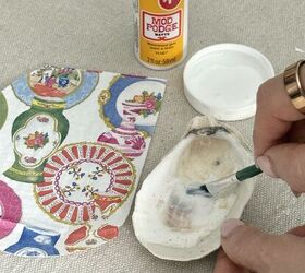 decoupage shells as wall art diy oyster shell flowers, Brushing a thin layer of decoupage glue onto the inside of oysters shells