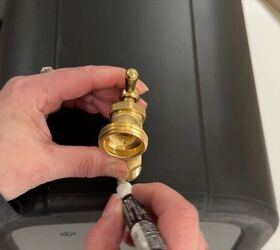 Turning a trash can into a rain barrel with spigot