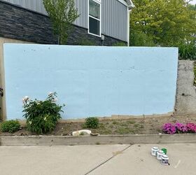 They painted their ugly cement wall white and then they did THIS (so pretty!)
