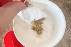 Pour a tea bag into baking soda for this clever cleaning tip