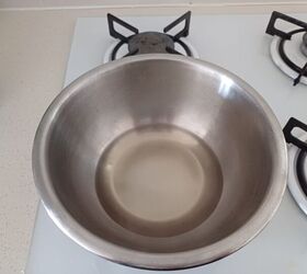 The pot with the mixture sitting on a stovetop heating up.