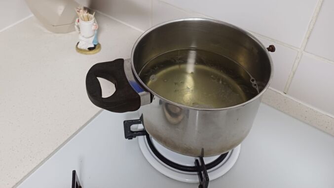 Steaming vinegar softens hard water stains for easier removal