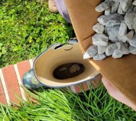 She pours rocks into an old rain boot for this sweet porch accent