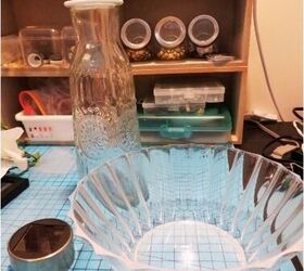 She glues a carafe to a vase for this clever lighting idea