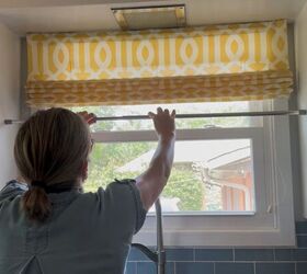 The clever 5-minute hack anyone can copy by hanging a tension rod below your window curtain