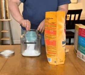 Pour baking soda and borax into a jar for this budget idea