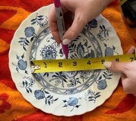She drills a hole through an old plate to get the prettiest kitchen accent