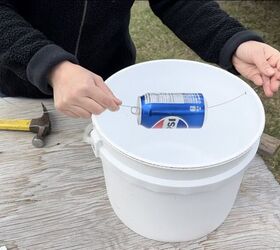 She hangs a soda can over a gallon bucket for this safe way to banish mice