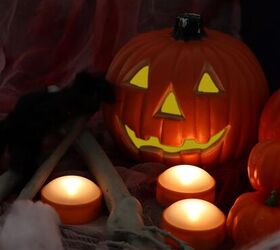 12 indoor halloween decor ideas that dont scream haunted house, Softly Lit Pumpkin Lanterns
