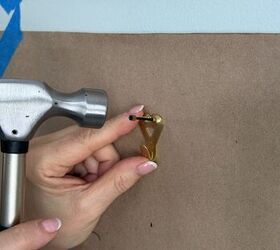 this simple trick makes hanging wall art 10x easier, Adding an OOK hook