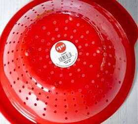 You're going to enjoy sitting outside so much more once you hang a colander in your garden