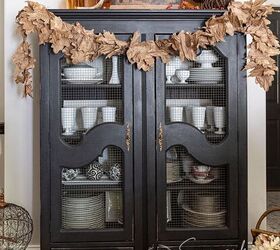 Recycled paper Fall leaf garland styled on a black hutch with amber glass pumpkins and fall art