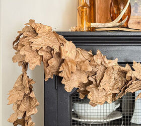 Recycled paper Fall leaf garland styled on a black hutch with amber glass