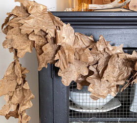 Recycled paper Fall leaf garland styled on a black hutch with amber glass
