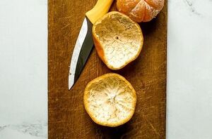She peels a few clementines for this stunning trick