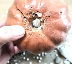 She cuts a hole through a foam pumpkin for one of the prettiest fall ideas we've seen so far this year