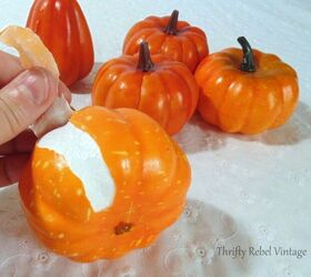 lace and ribbon pumpkins makeover, peeling off plastic coating from orange dollar store pumpkins