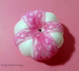 lace and ribbon pumpkins makeover, gluing pink lace onto styrofoam pumpkin