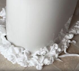 Spraying shaving cream around toilet base