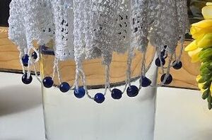 Put a doily over a vase for this beautiful decor hack