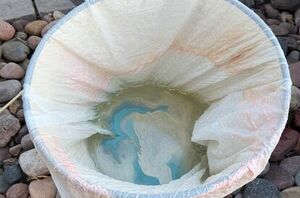 Pour nail polish into a trash bag for this stunning refresh