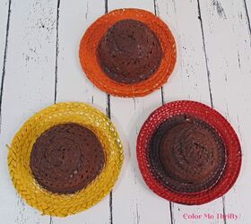 repurposed clothes pins into fall flowers, spray painted straw hats with brown centers