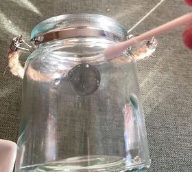 Wipe a glass jar with a Q-tip for this pretty decor idea