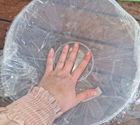 She puts cling wrap over a bowl for easy and unique decor