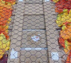 how to dress up a dollar store fall sign, back of fall sign attached to chicken wire with zip ties