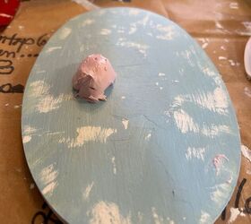 She puts a dollop of spackle paste on wood tags for meaningful Christmas decor