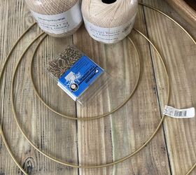 She grabs a bunch of crochet threads and a few wire hoops from Michaels for this boho idea that looks incredible in her bedroom