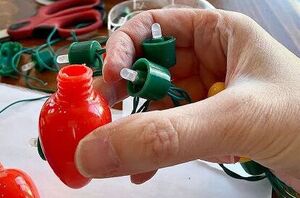She unscrewed the bulbs off a string of Christmas lights for charming holiday decor